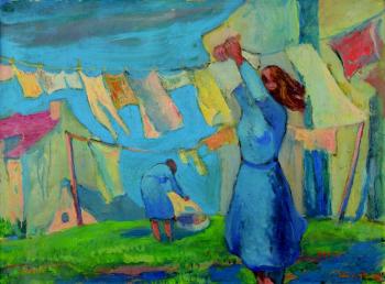 A woman hanging laundry A woman hanging laundry